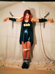 Bound latex bat girl